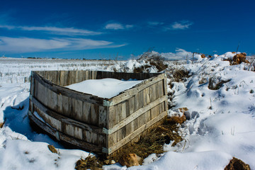 Abandoned caisson covered with snow