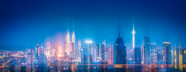 Fototapeta na wymiar Kuala Lumpur city skyline with wireless network connection at night in Malaysia. Abstract communication technology concept