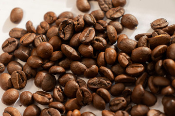 coffee beans a lot of coffee scattered on a white background