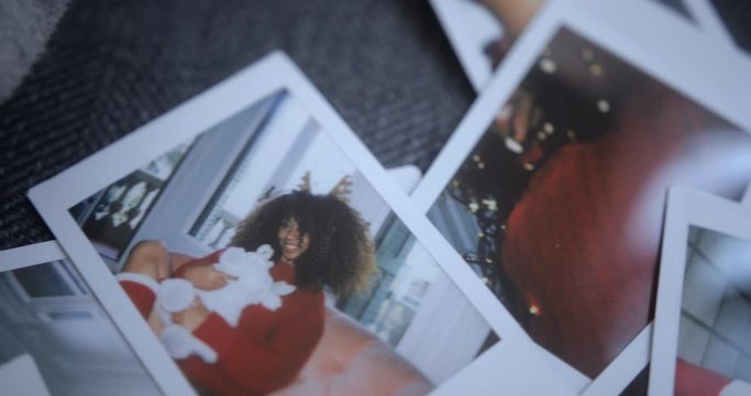 Background of Christmas photos of black woman wearing red sweater