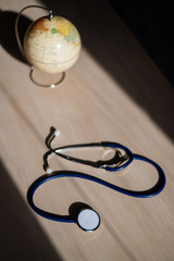 Globe and stethoscope. The concept of global warming and pollution. Phonendoscope and earth...