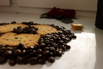Breakfast coffee cookies morning still life background coffee grain on a white background flowers roses