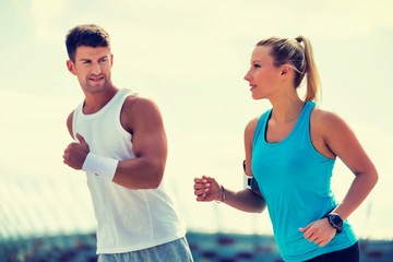 Young couple excersising in park
