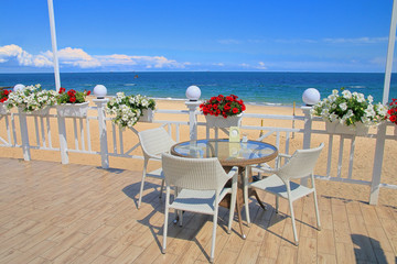 Fototapeta na wymiar Cozy veranda on the coast of the sea.