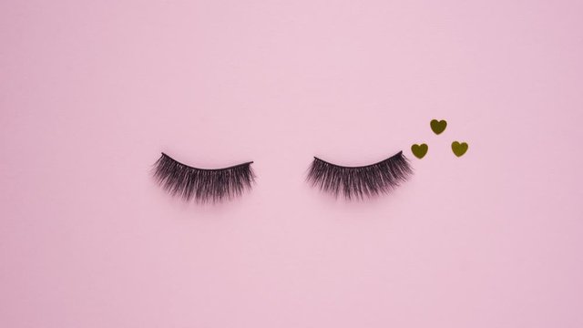Creative concept beauty fashion flatlay stop motion media video film movie footage lashes extension eyelashes with hearts.