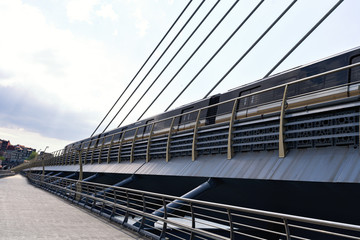 metro train on a bridge. Subway train on open bridge in istanbul golden horn station
