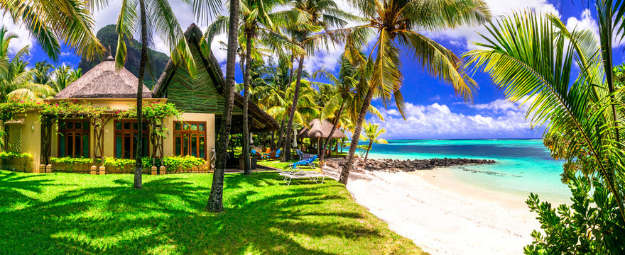 Relaxing holidays in tropical paradise Mauritius island. Luxury villas of Paradis Beachcomber Golf Resort & Spa. Feb.2020
