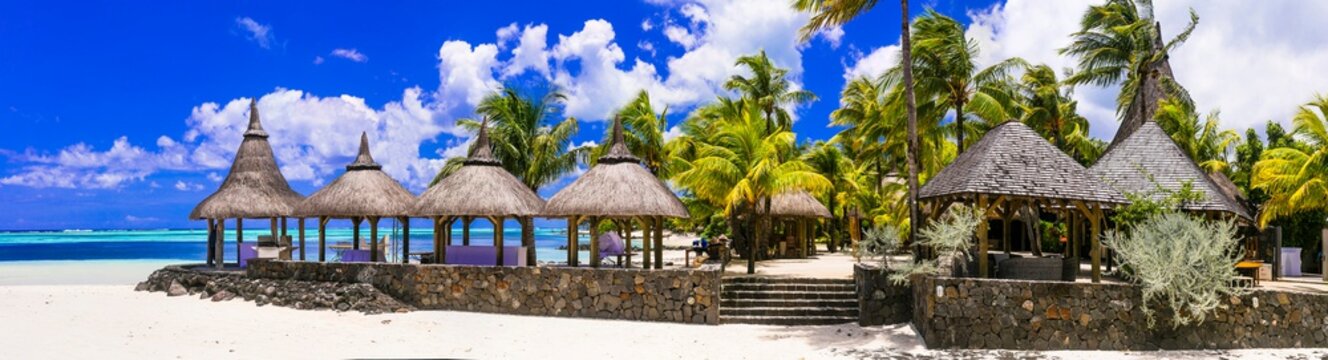 Exotic tropical beach scenery.  Restaurant by the sea. Mauritius island.  Paradis Beachcomber Golf Resort & Spa. Feb.2020
