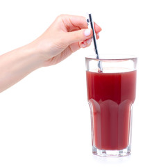 Hand holding glass of pomegranate juice with tube on white background isolation