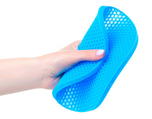 Silicone table coasters in hand on a white background isolation