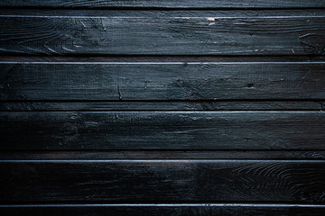 background of parallel wooden boards, black color, place for text