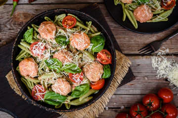Delicious fresh pasta with meatballs, sauce, cherry tomatoes and basil