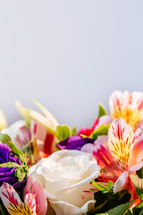 Border frame made of flowers on wooden background. Flat lay. Top view with copy space. Selective focus. Frame of flowers.
