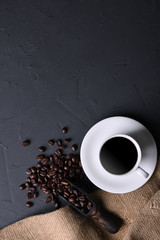 Coffee cup and beans on old grey kitchen beton , rock table. Top view with copyspace for your text