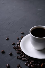 Coffee cup and beans on old grey kitchen beton , rock table. Top view with copyspace for your text