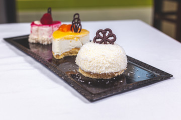 3 cakes on plates
