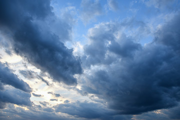 Fototapeta na wymiar Stormy sky with storm clouns on the sunset with beautiful sun
