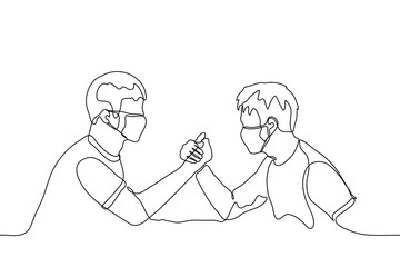Two men in medical protective masks are engaged in arm wrestling. Arm wrestling, wrestling, a dispute between two friends, the concept of conflict of interests. Can be used for animation.