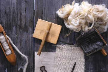Wooden weaving shuttle on an old manual weaving machine