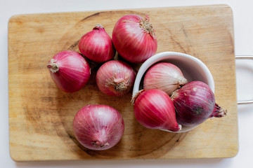 sweet onions on the wood table