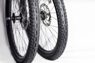 New bicycle tires on wheels from a mountain bike, close up