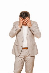 Middle age businessman in beige suite, broken and depressed as his business falling during recession of coronavirus, isolated on white background