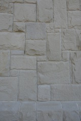 Structured background: stone or granite blocks as wall 