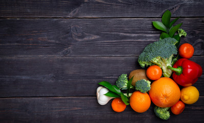 Vegetables and fruits to maintain immunity on a black background. Copy space