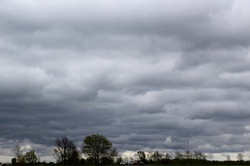 The dark gray rain clouds in the skies.