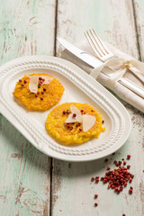 strir fried rice with parmesan cheese flakes and pink pepper