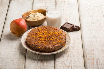 chocolate cake with pear milk and orange grated peel