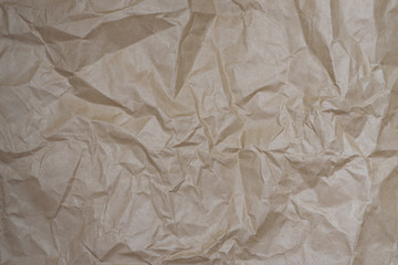 Close up craft crumpled beige paper for background usage. Cope space.