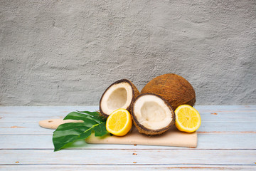 Coconuts and lemons on the table 