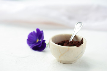 On a white background in a cup of cocoa with a spoon.
