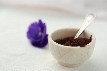 On a white background in a cup of cocoa with a spoon.
