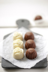 Handmade sweets. Sweets made of white and dark chocolate.
