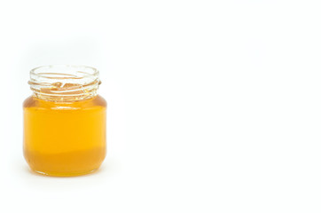 jar of honey on a white background