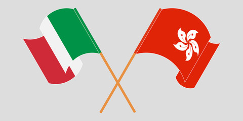 Crossed and waving flags of Hong Kong and Italy