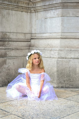 Girl ballerina Paris sitting on a old stone background. Beautiful model. Happy dancing people. Love fashion. © Elena