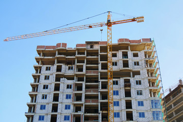 Fototapeta na wymiar Construct. Construction site. Building site with crane. Concrete building under construction