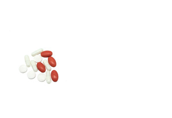 medical pills of red and white colors on a white background