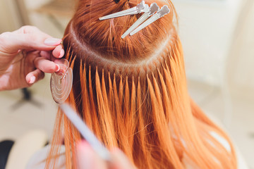 Hair salon, beauty spa. Procedure of hair extensions.