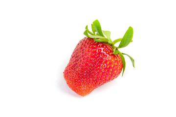Red fresh strawberries on a white background. Green leaves of strawberries. Strawberry on a white background.