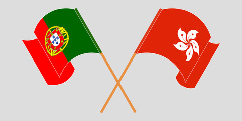 Crossed and waving flags of Hong Kong and Portugal