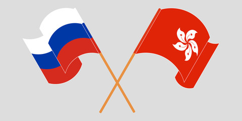 Crossed and waving flags of Hong Kong and Russia