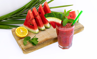 Watermelon drink in glasses with slices of watermelon and mint