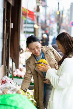 Woman shopping for vegetable at store