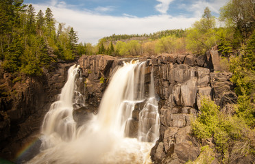 High Falls at US/Canadian border at Grand Portage State Park Minnesota. Horizontal Waterfall 
