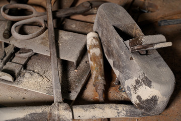 Set of various old equipment, sawdust on instruments. rusty tools for carpenter work on wooden table. Ideal for banner                             