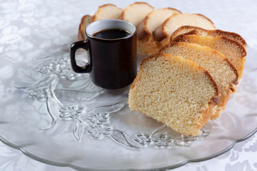 Slices of cake and a cup of coffee on a plate on a table